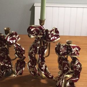 3 brass bugle candlesticks with ribbons.
